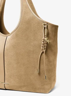 Breloque de sac dorée avec cordon tressé