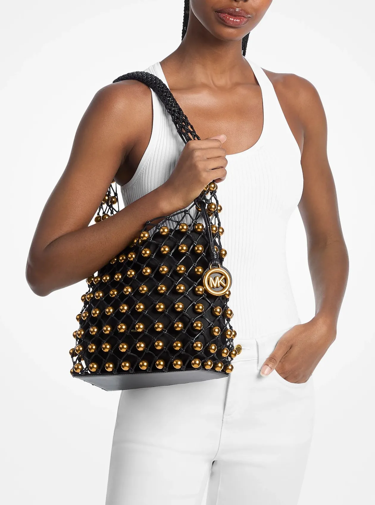 Petit sac bohème porté épaule Gwen en cuir tissé à la main et clouté en édition limitée