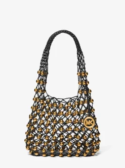 Petit sac bohème porté épaule Gwen en cuir tissé à la main et clouté en édition limitée